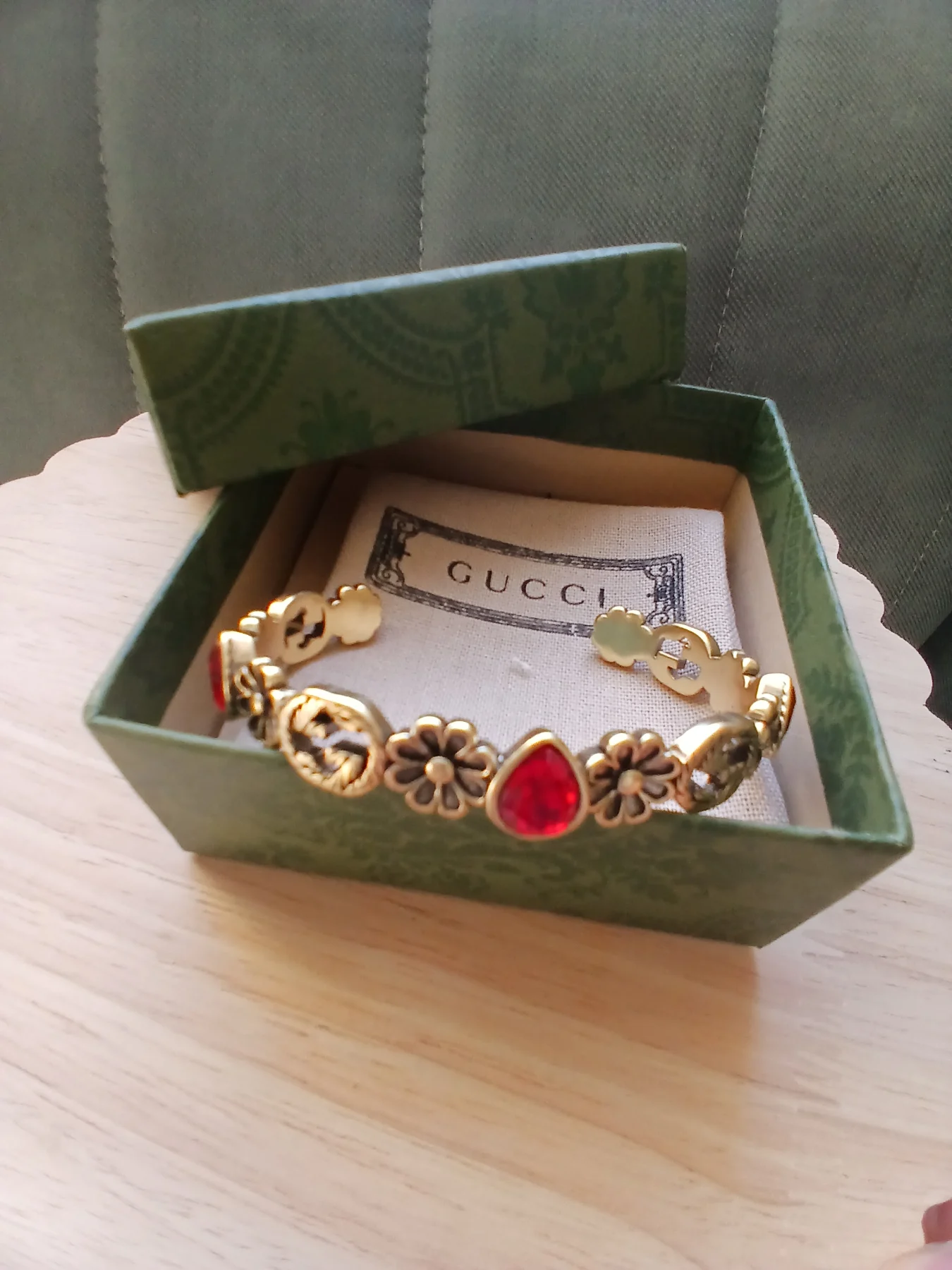 Bracelet in Aged Gold Tone with Red Stone Details