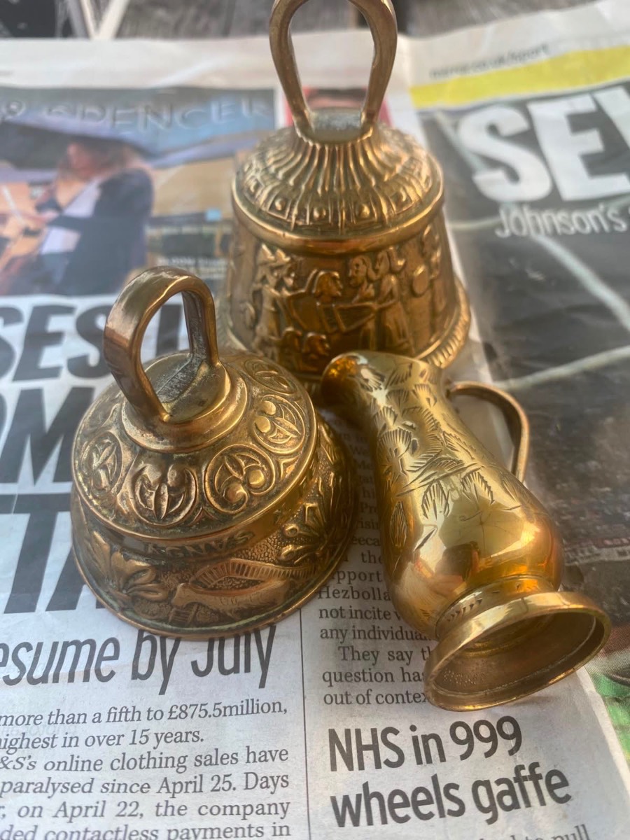 vintage, solid brass sanctuary bells featuring embossed animal designs and Latin inscriptions