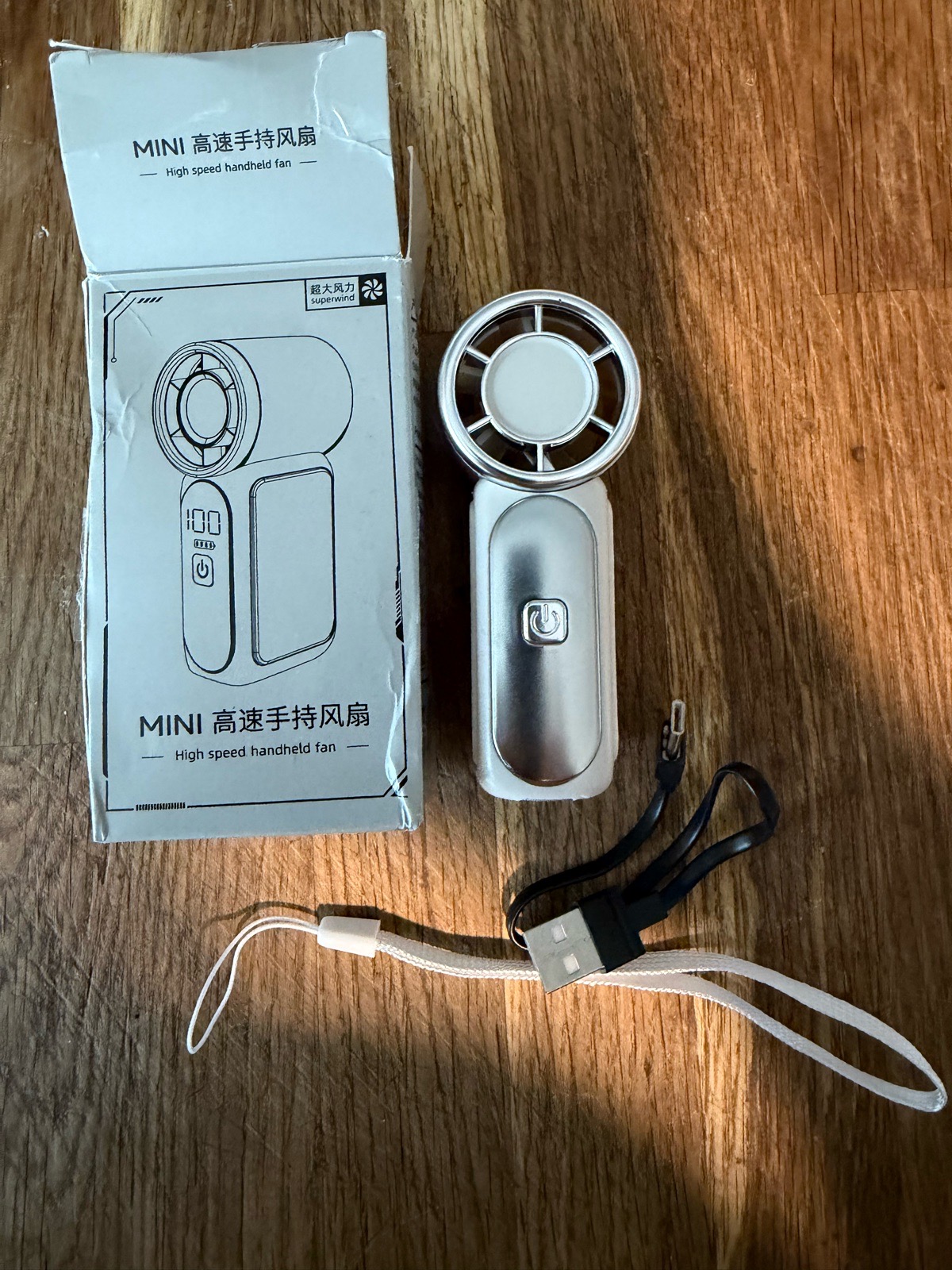 Superwind Mini High-Speed Handheld Fan (Model X688), a portable turbo personal fan featuring a digi