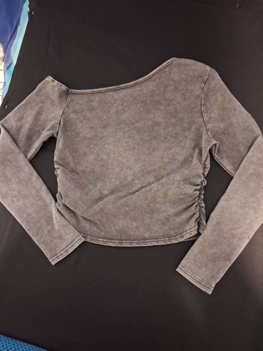 Grey long sleeve top with asymmetrical neckline