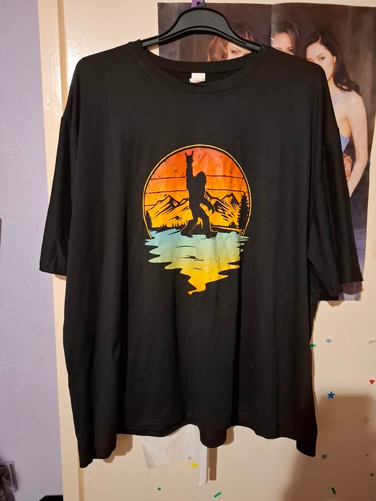 Black t shirt with a colourful gorilla
