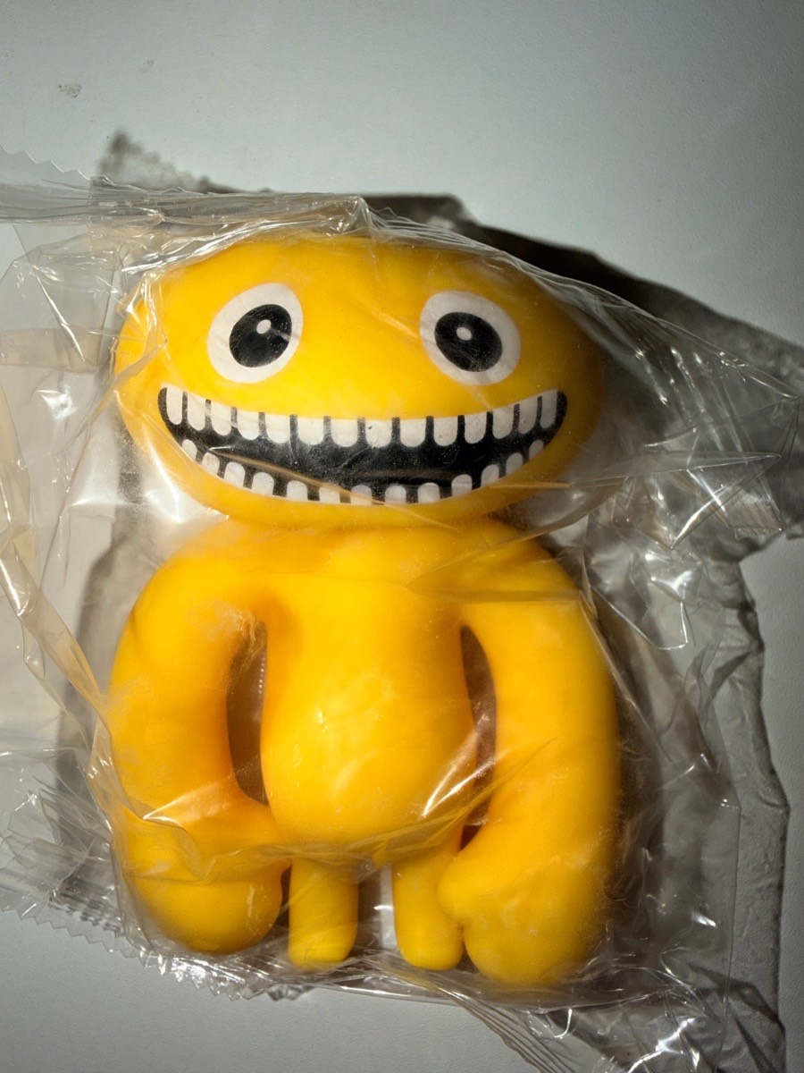 Yellow squishy alien fidget toy