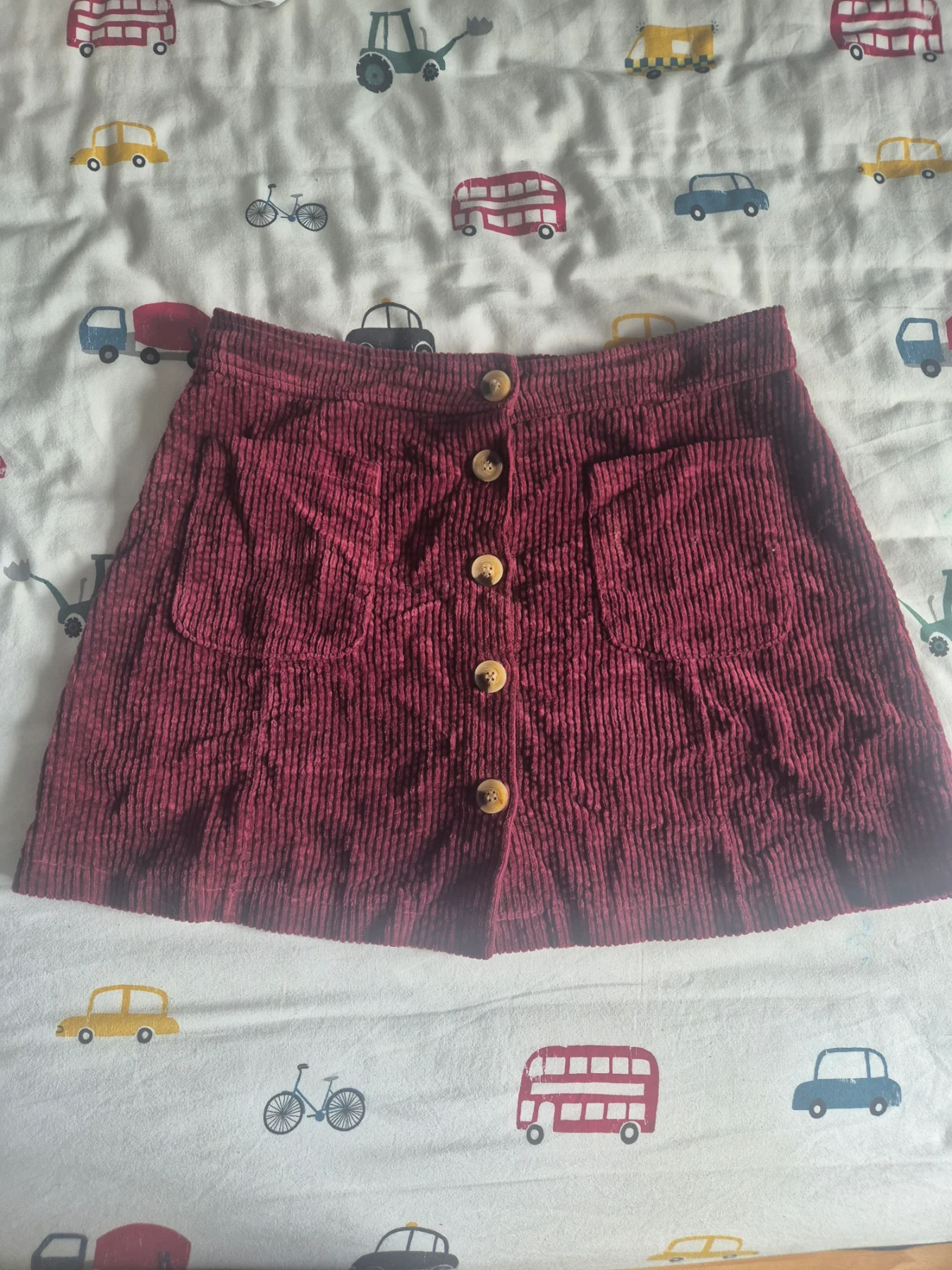 Burgandy corduroy with button-front and front pockets, size medium