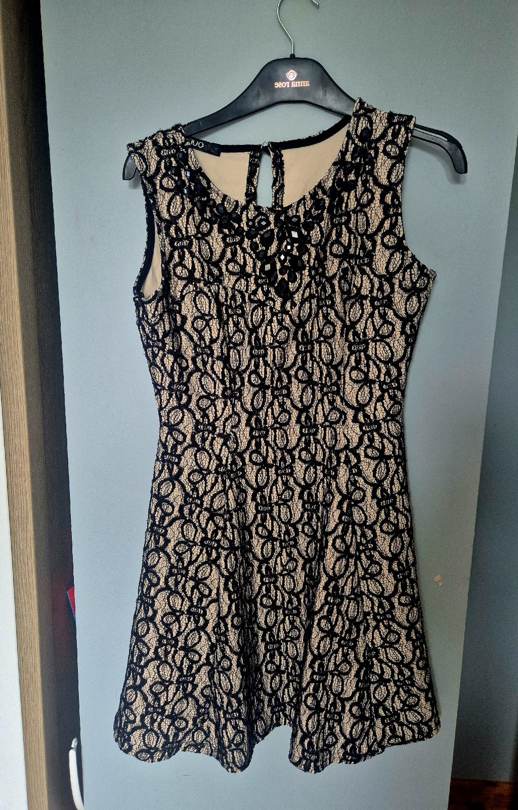 sleeveless black lace skater dress with nude-toned lining and embellished neckline size 12,