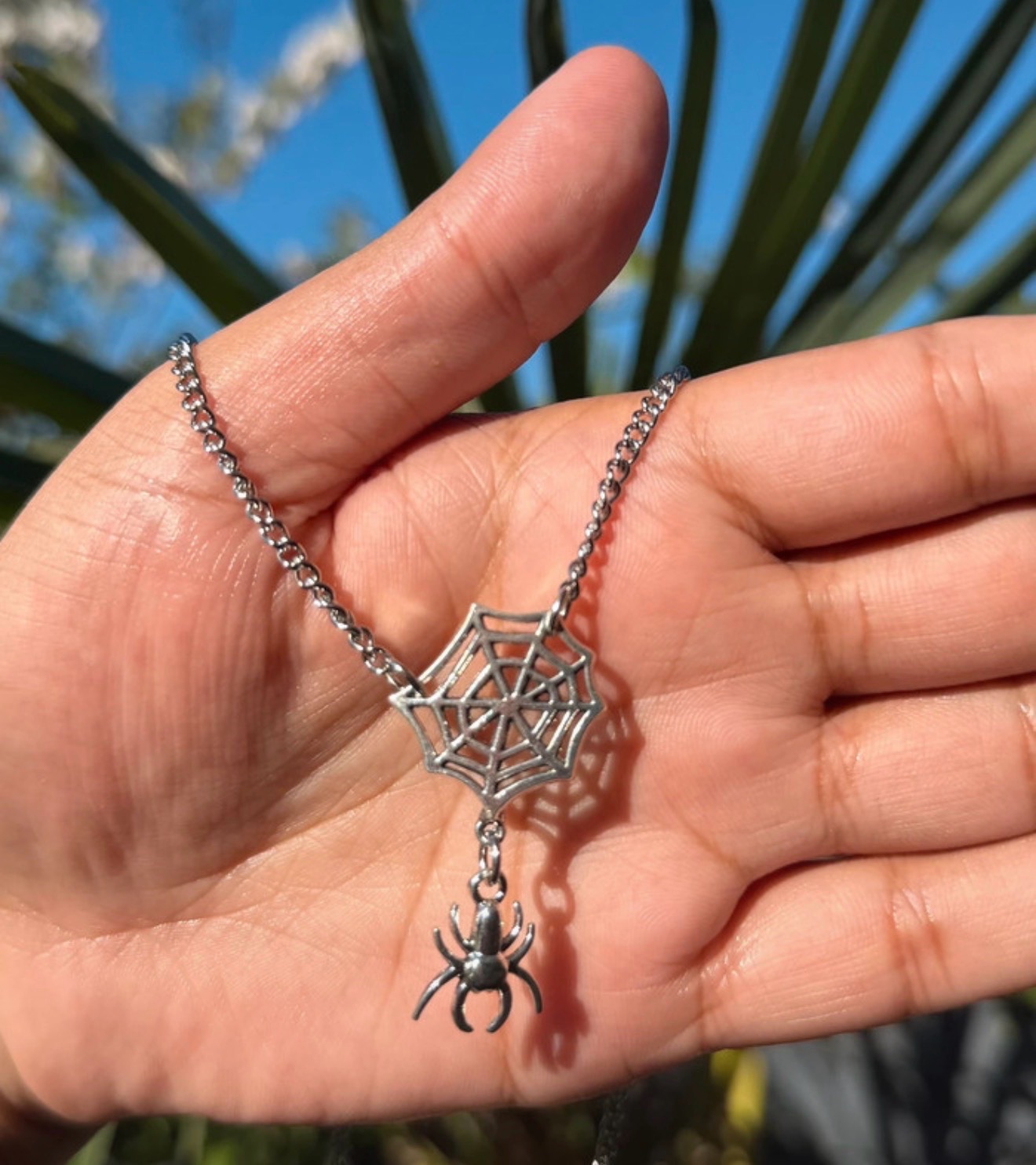 Gothic alternative silver coloured spider and web necklace