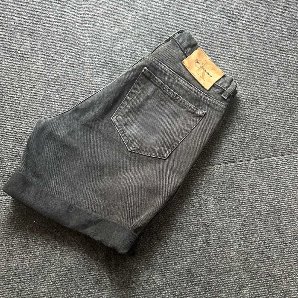 Calvin Klein washed black denim shorts rolled cuff women's