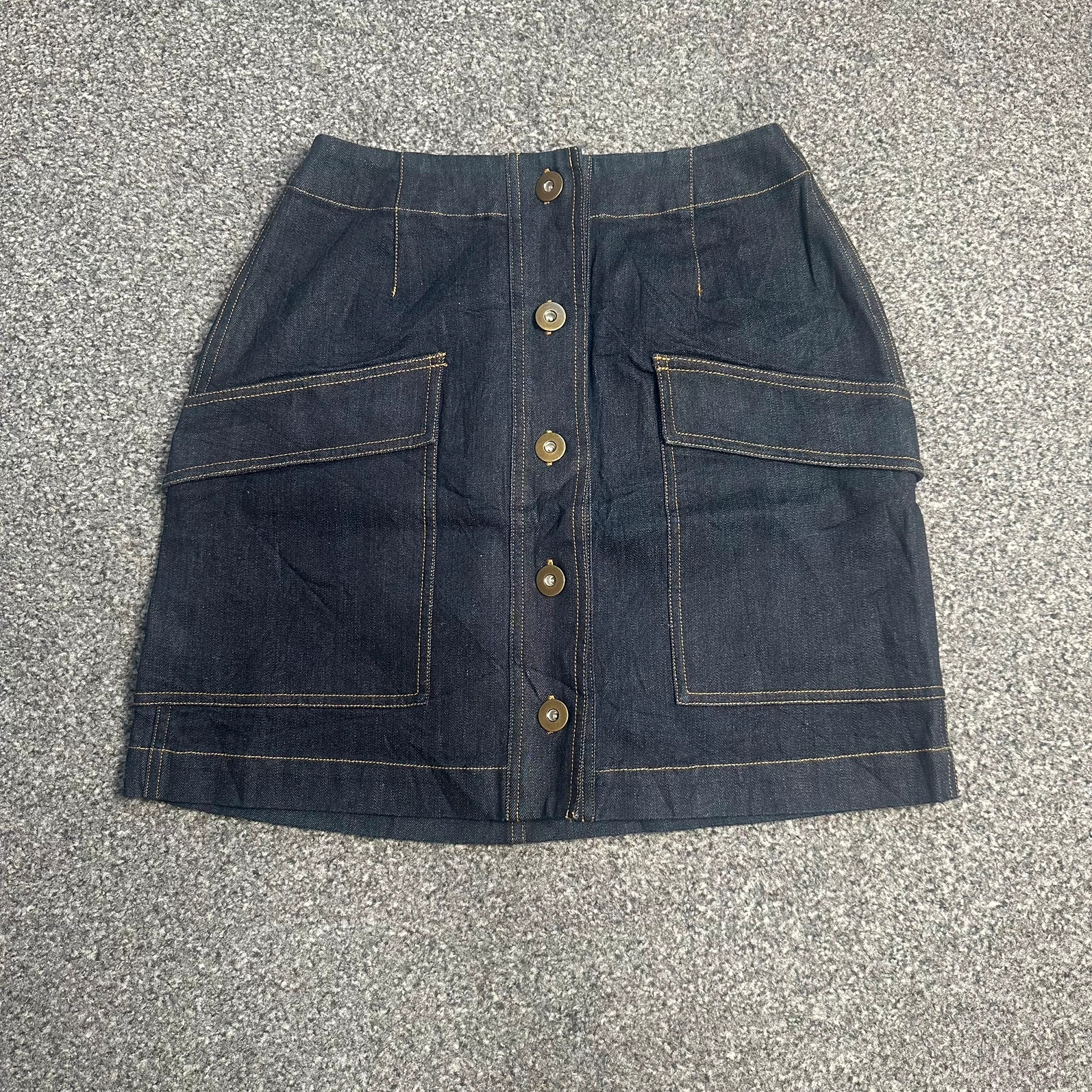 Dark indigo denim mini skirt button front patch pockets contrast stitch