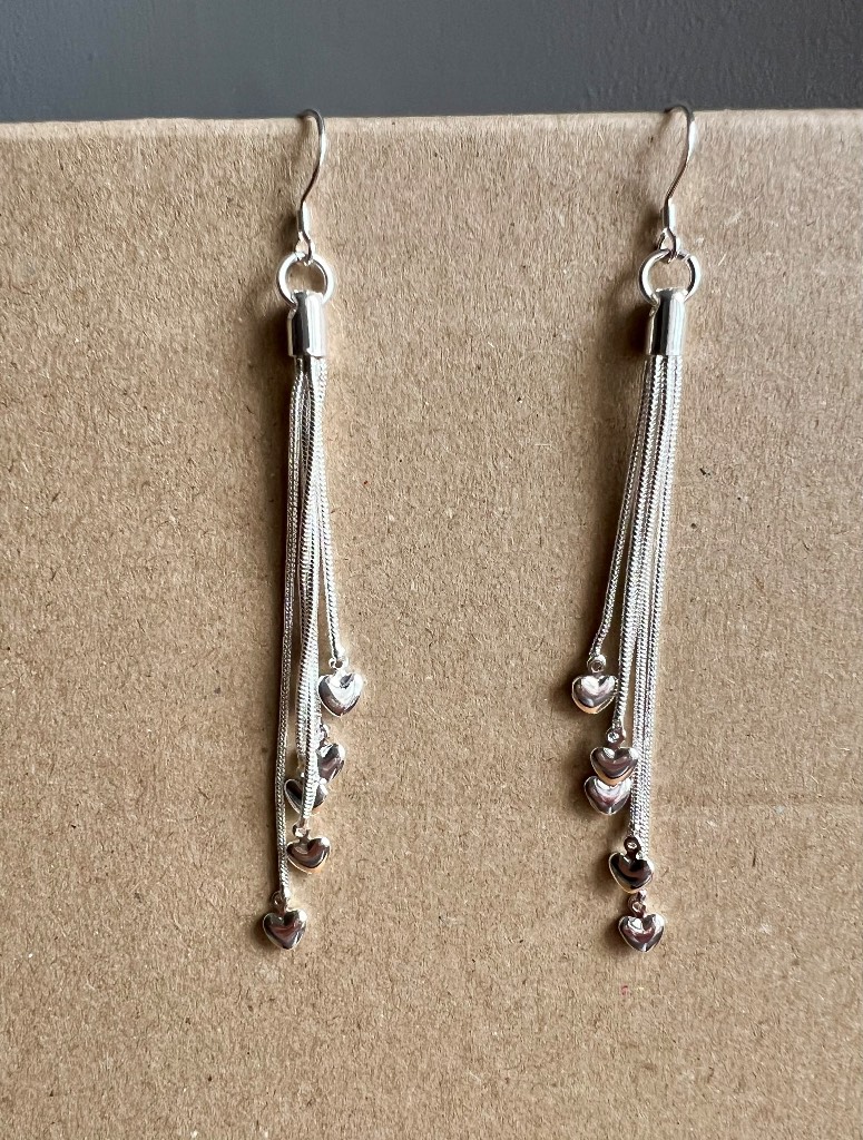 Stunning drop pair of earrings with dangling hearts