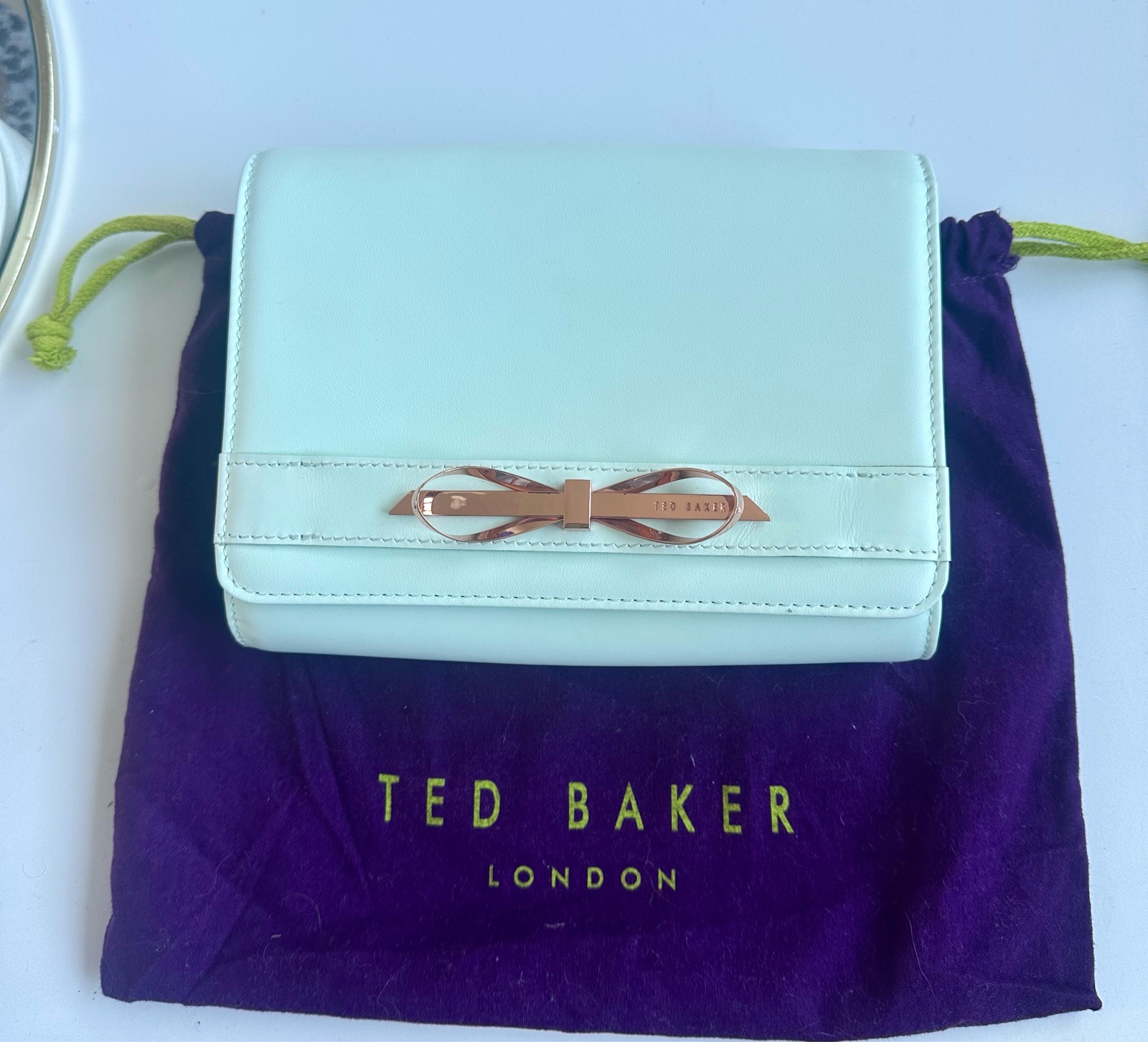 Gorgeous Ted Baker Mint Green Leather Clutch Bag with Rose Gold Bow