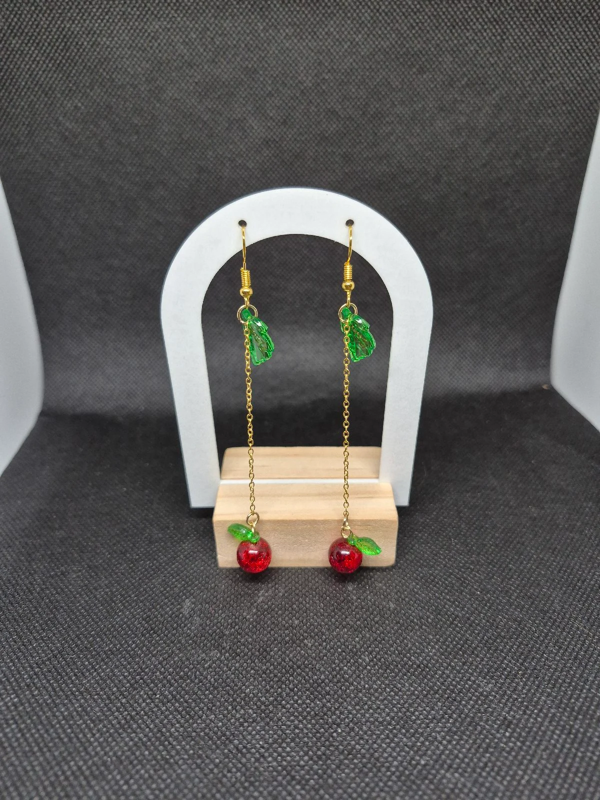 Red glass apples on a chain
