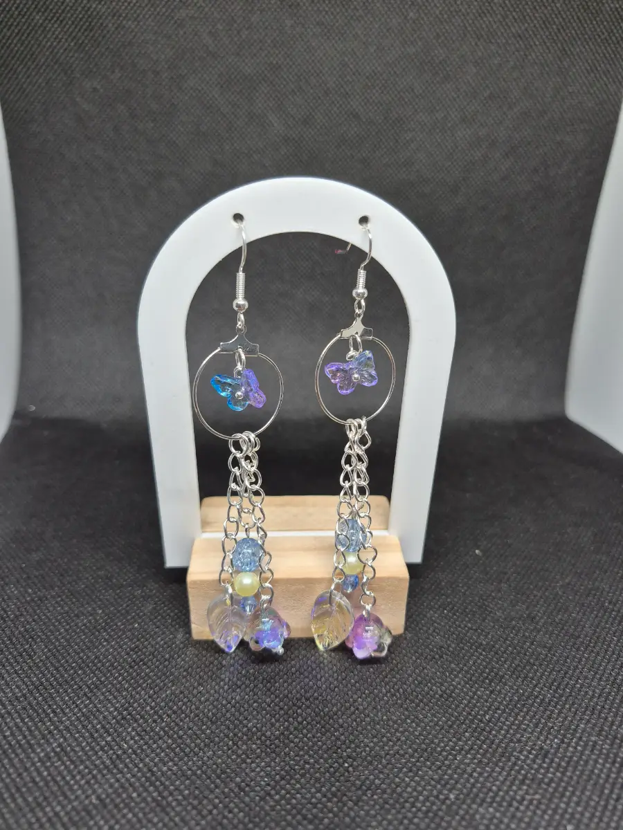 Silver hoop earrings with dangling butterfly