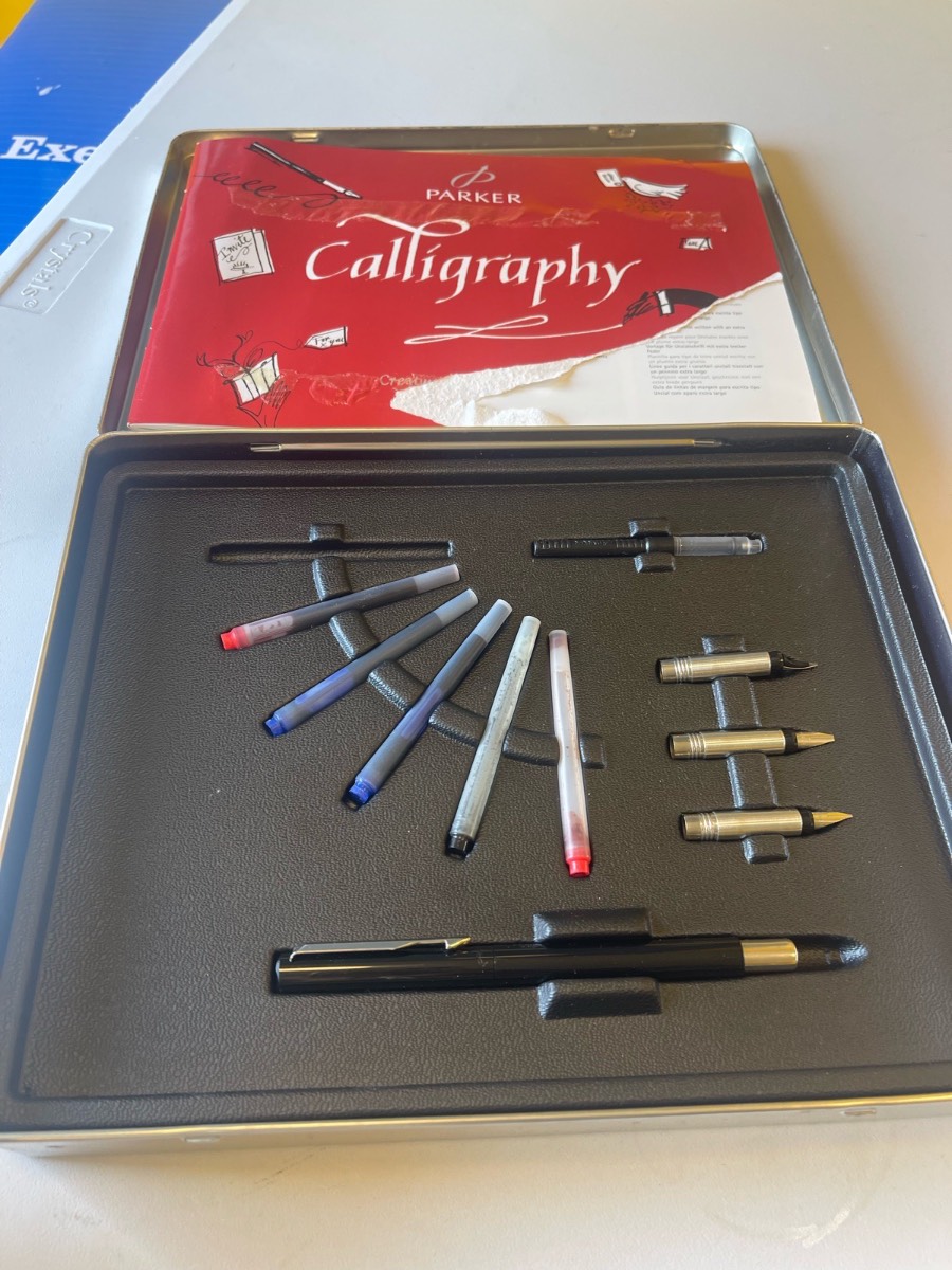 Vintage Parker calligraphy set in metal tin