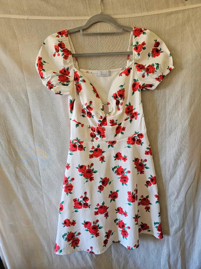 quiz knee length short sleeve dress. white with red floral pattern