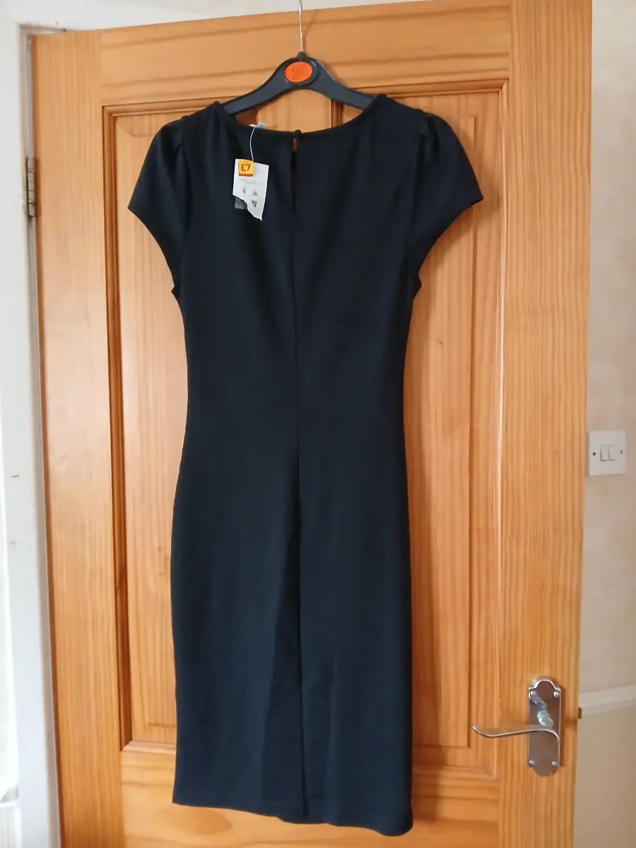 Black fitted dress with lace neckline