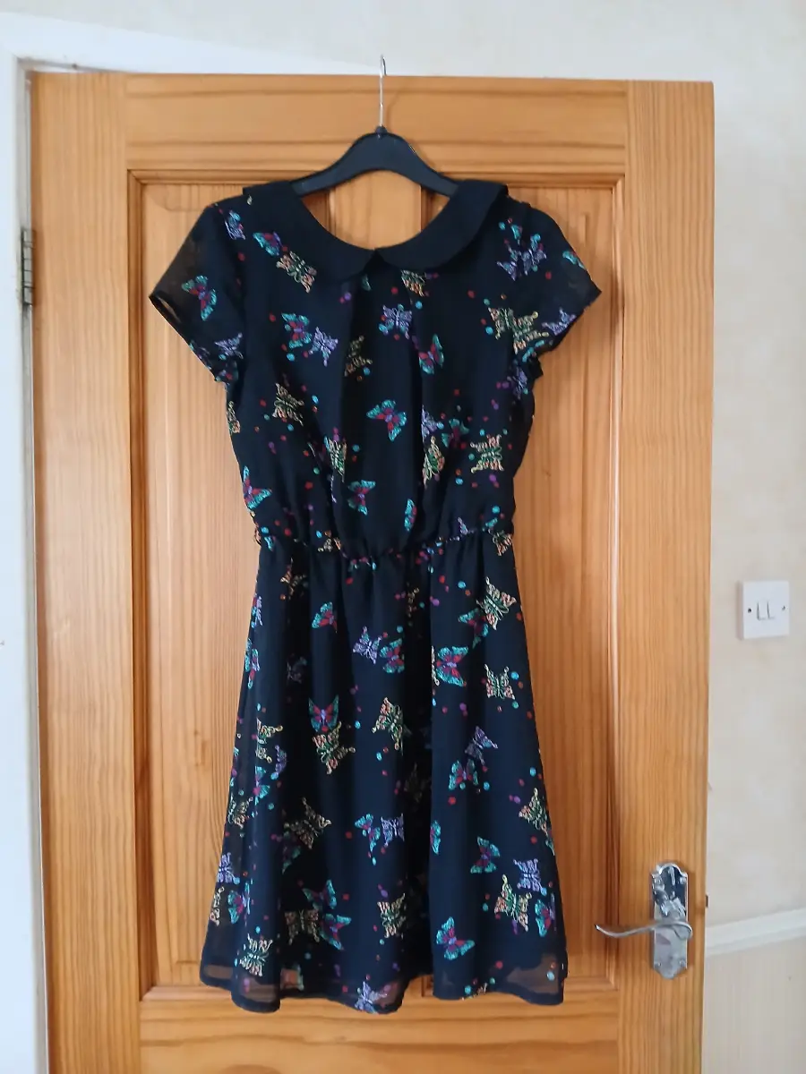 Black tea dress with butterfly pattern
