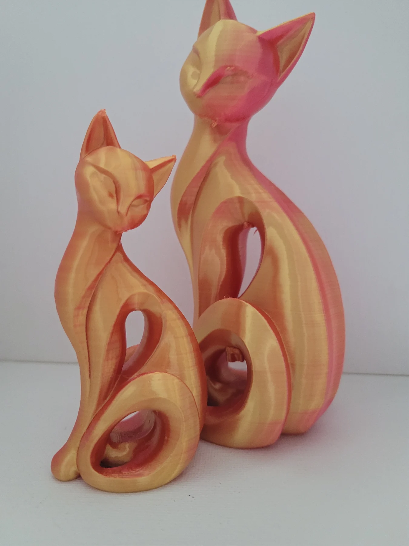 Two stylish cat ornaments