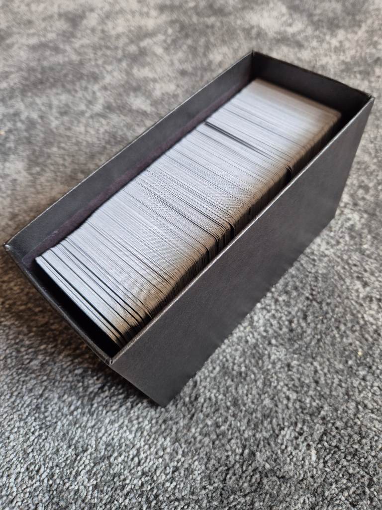 An ETB box thats full of Pokemon Cards tcg