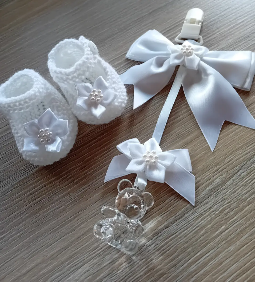 New knitted baby shoes and charm