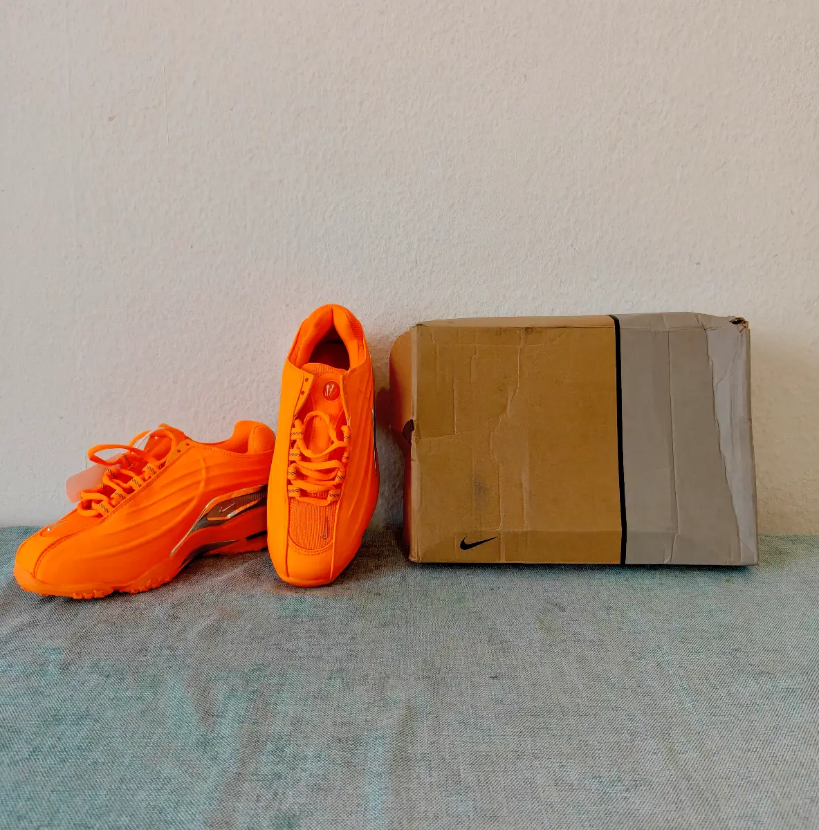 Nike x NOCTA Hot Step 2 "Total Orange" sneakers (Style Code: DZ7293-800).