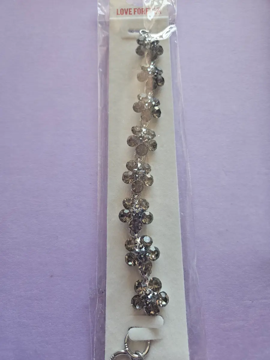 Bracelet black and silver in colour