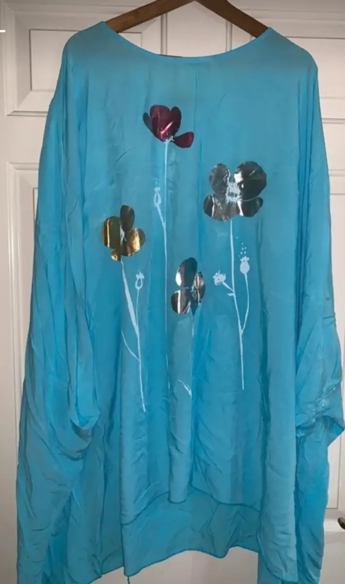 Ladies blue floaty top with pretty flower detail