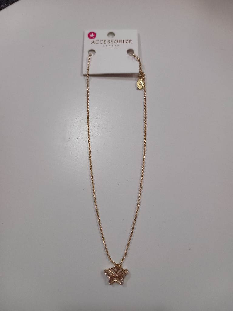 Accessorize gold tone necklace with rhinestone butterfly pendant