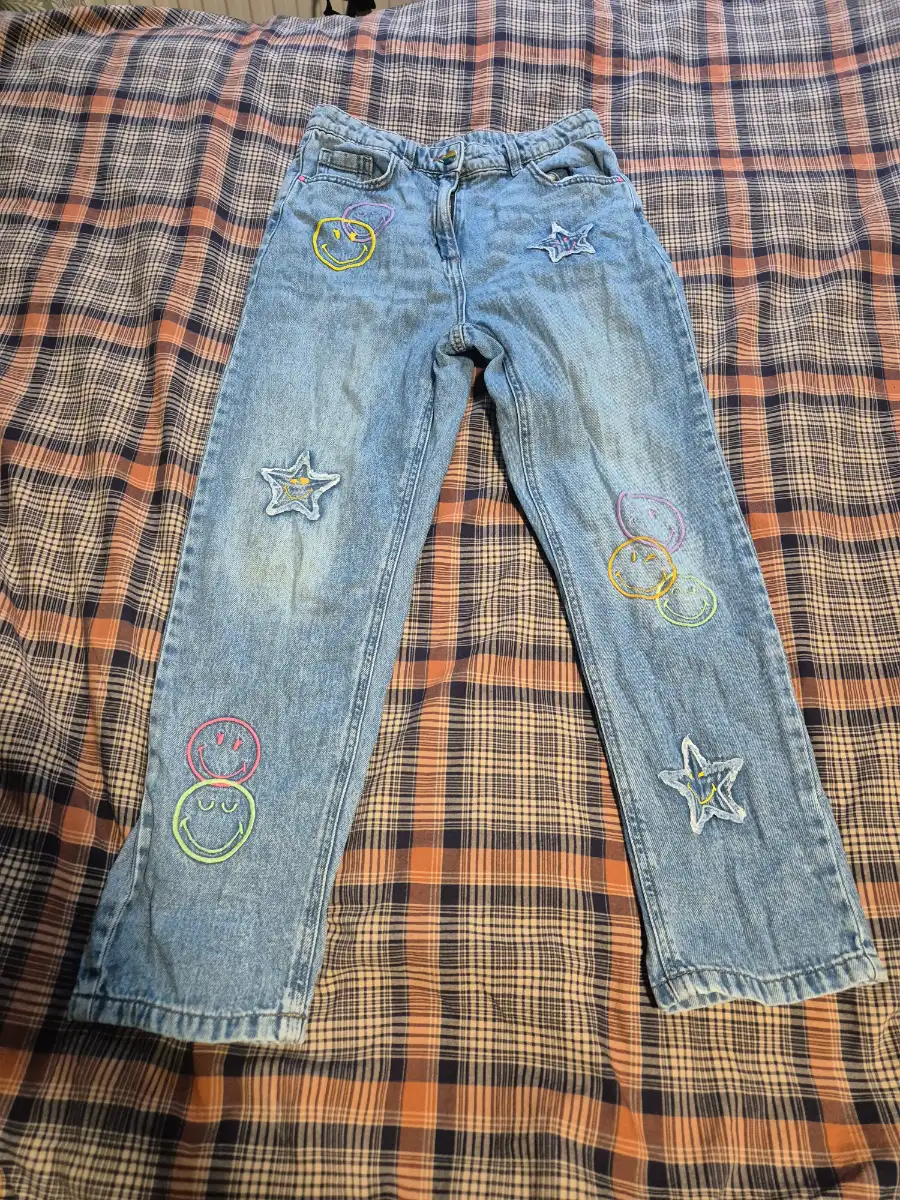 Next blue denim jeans with smiley face and star patches, size 12