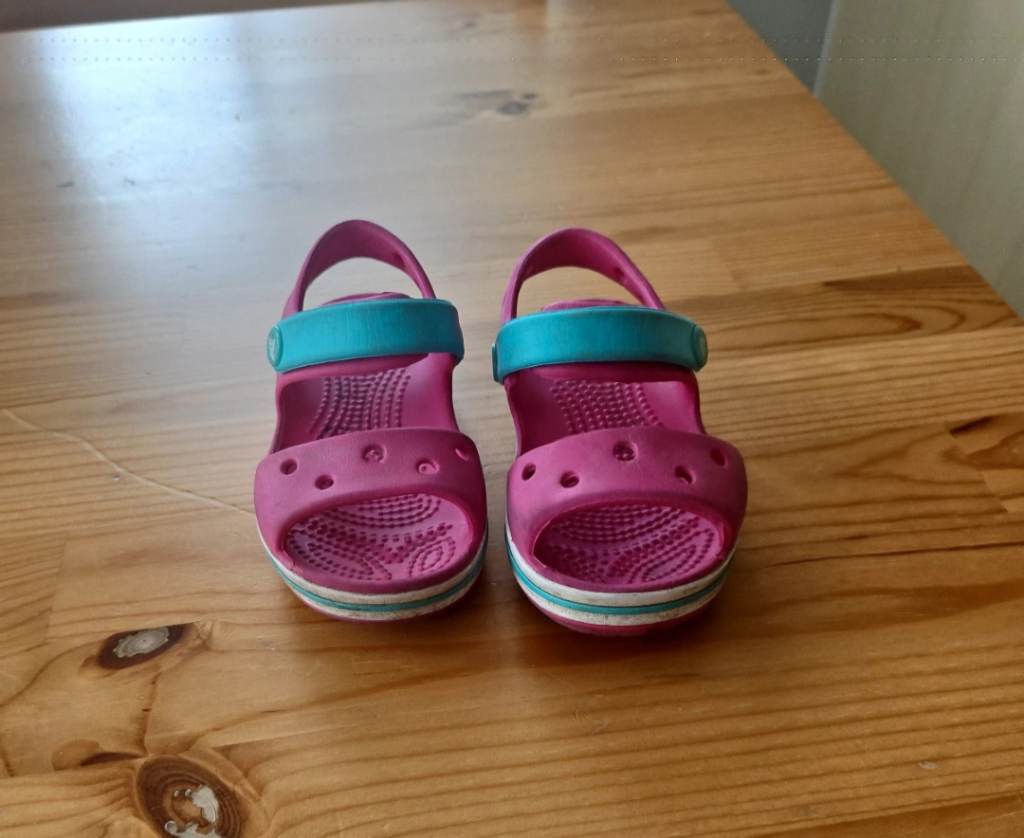 Pink and turquoise croc sandals size c6