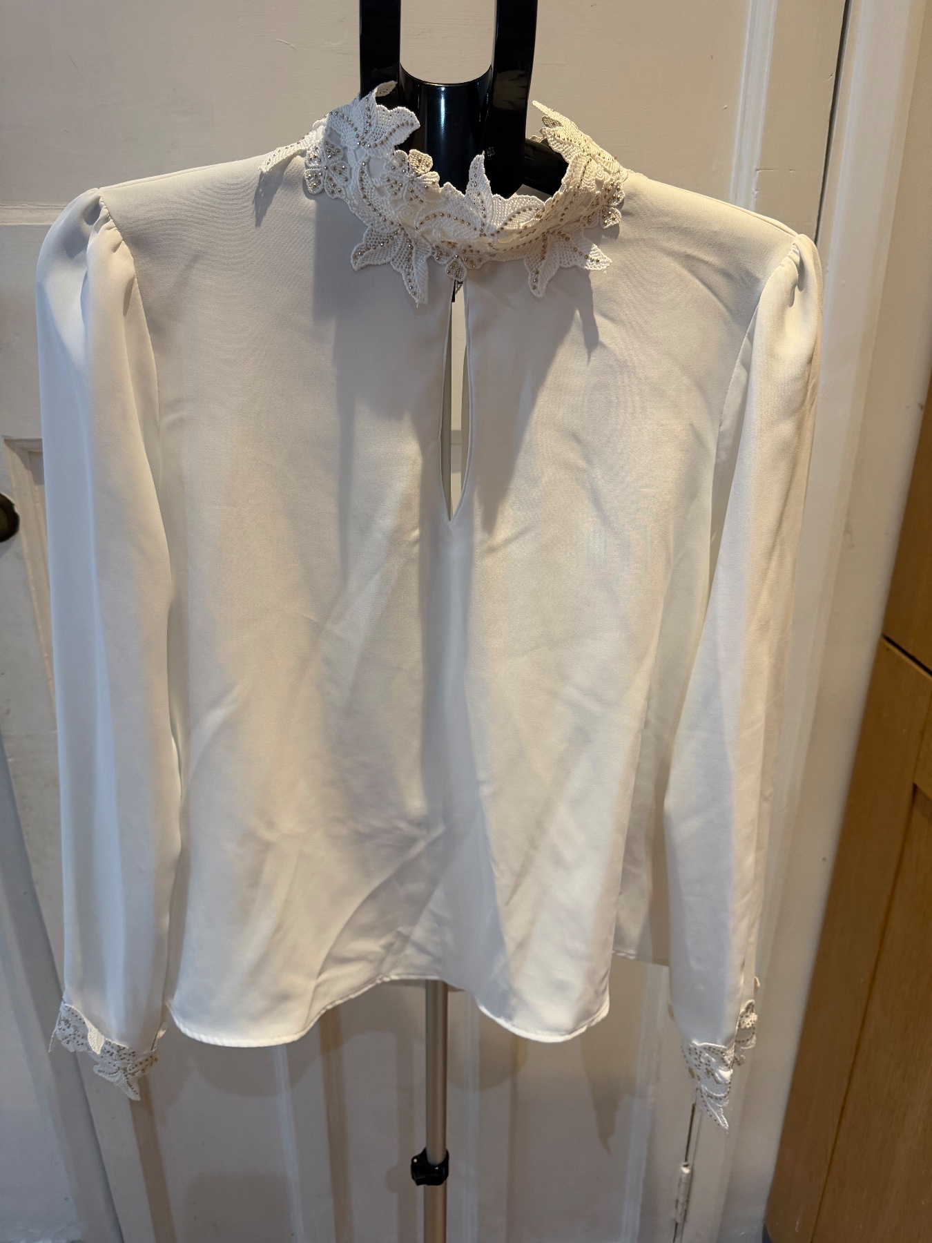 Zara white long sleeve blouse, with a pattern on neck and cuffs size large