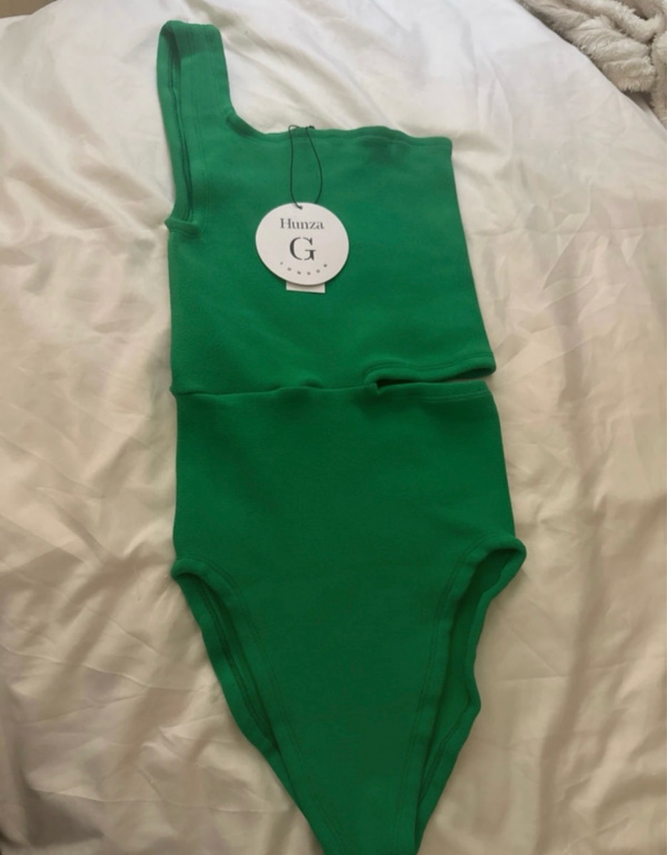 Green swimsuit with tag on swimsuit