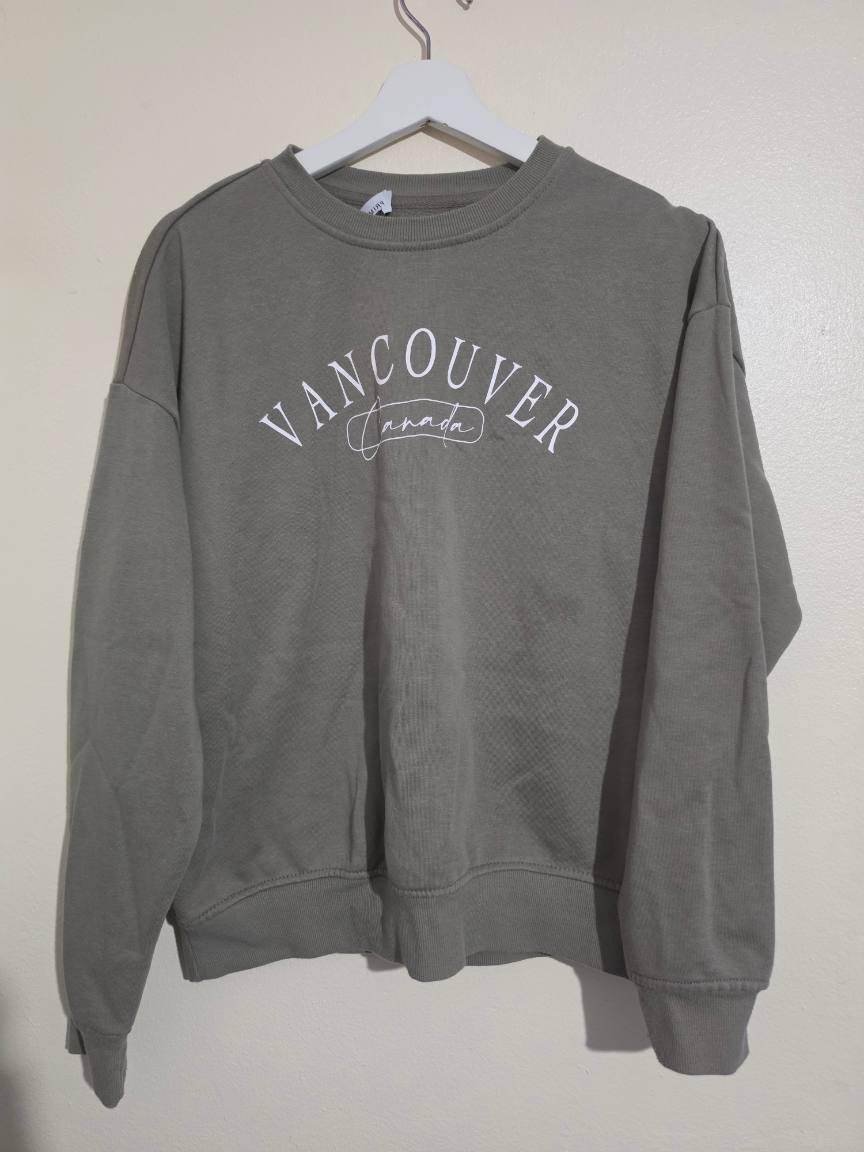 Womens size 10/12 Primark khaki round neck jumper, Vancouver logo across front, VGC