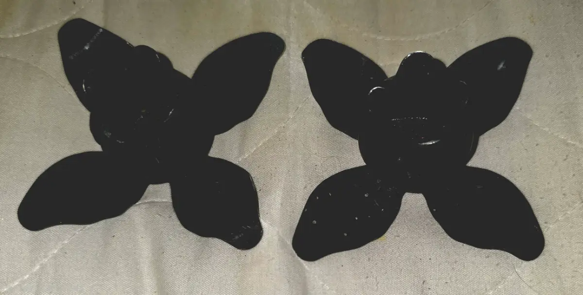 Pair of black metal rosebud candle holders