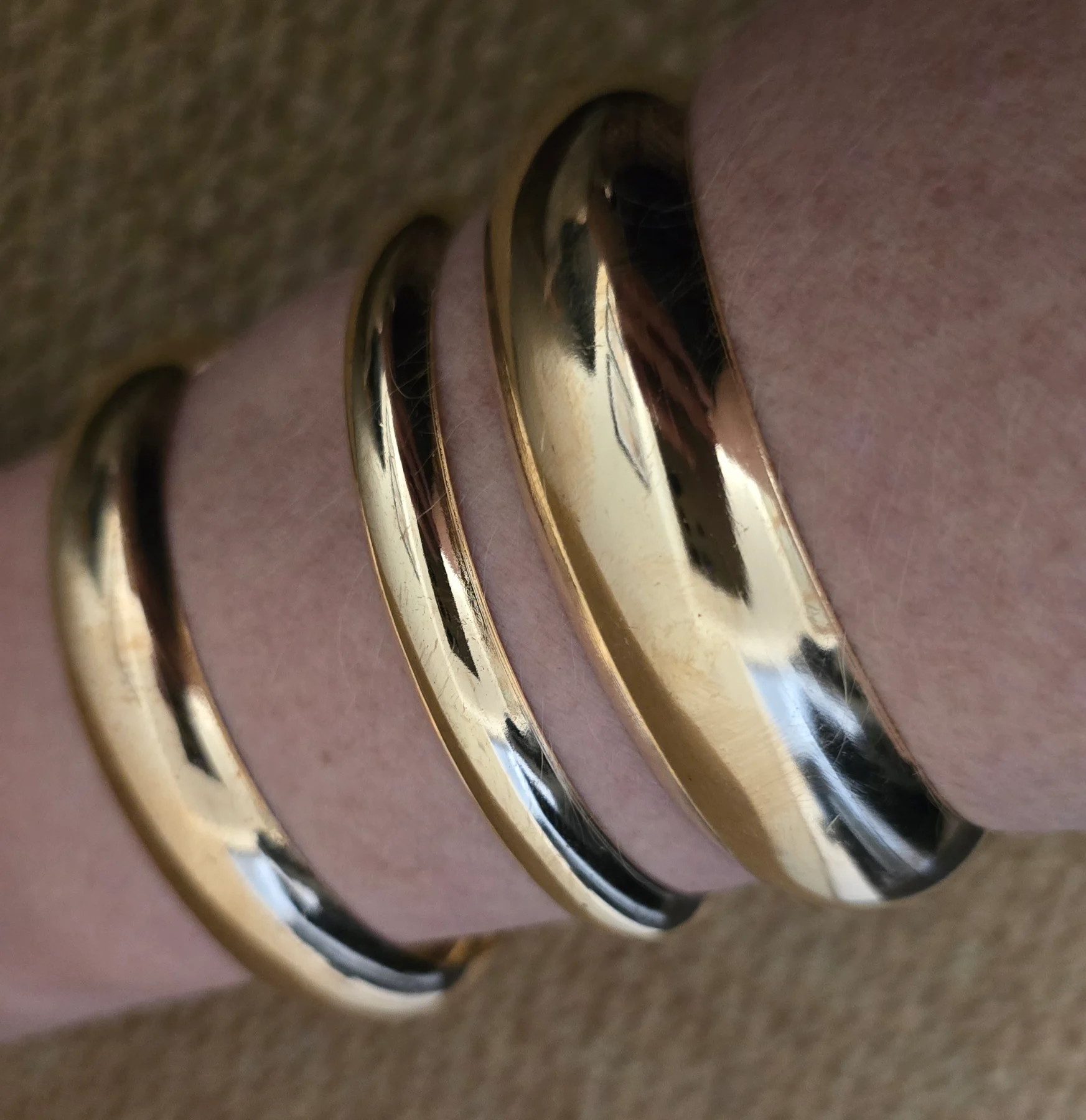 Set of 3 Assorted Sized Gold Tone Bangles.