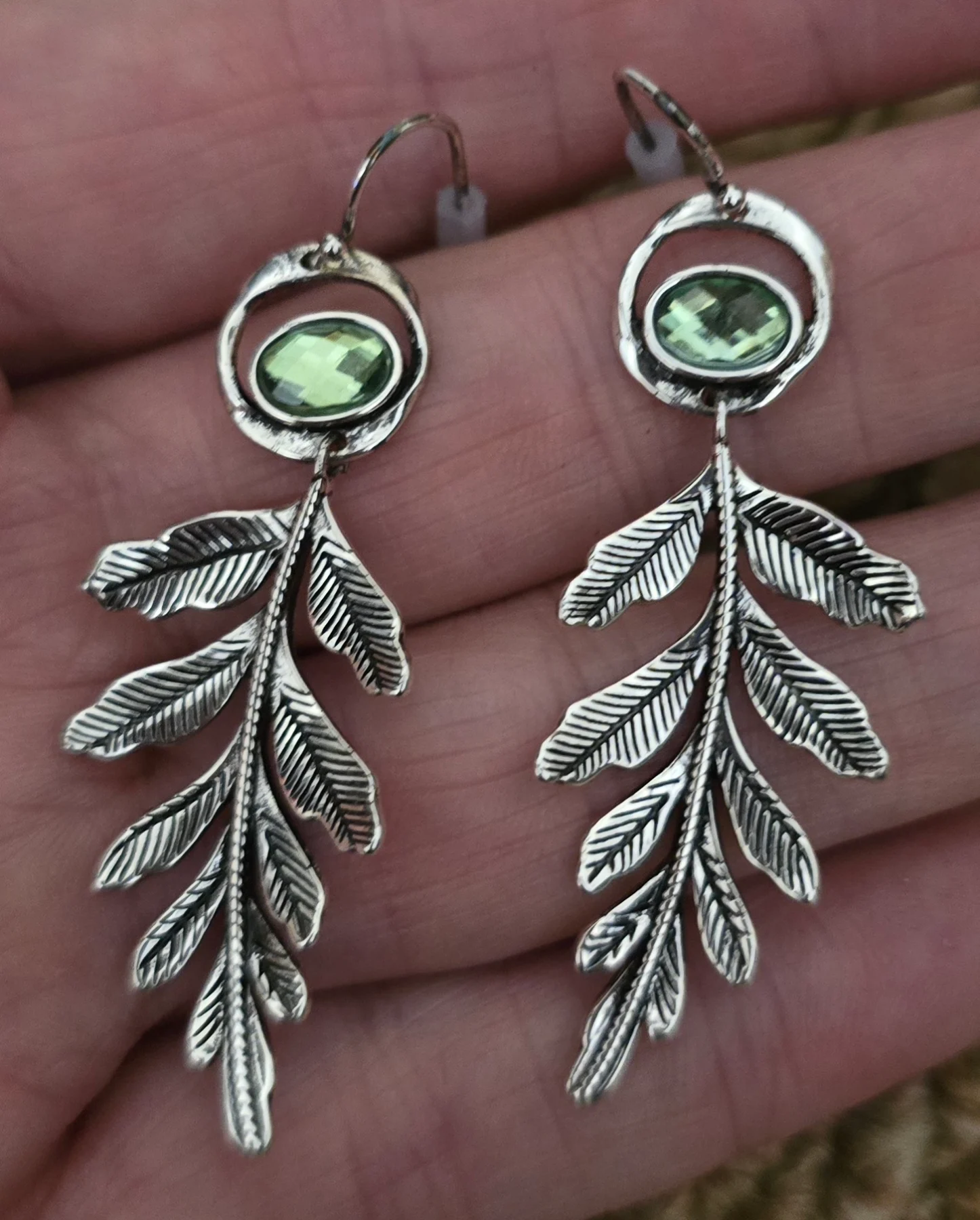 Stainless Steel Silver Tone with Green Gem Detail Earrings.
