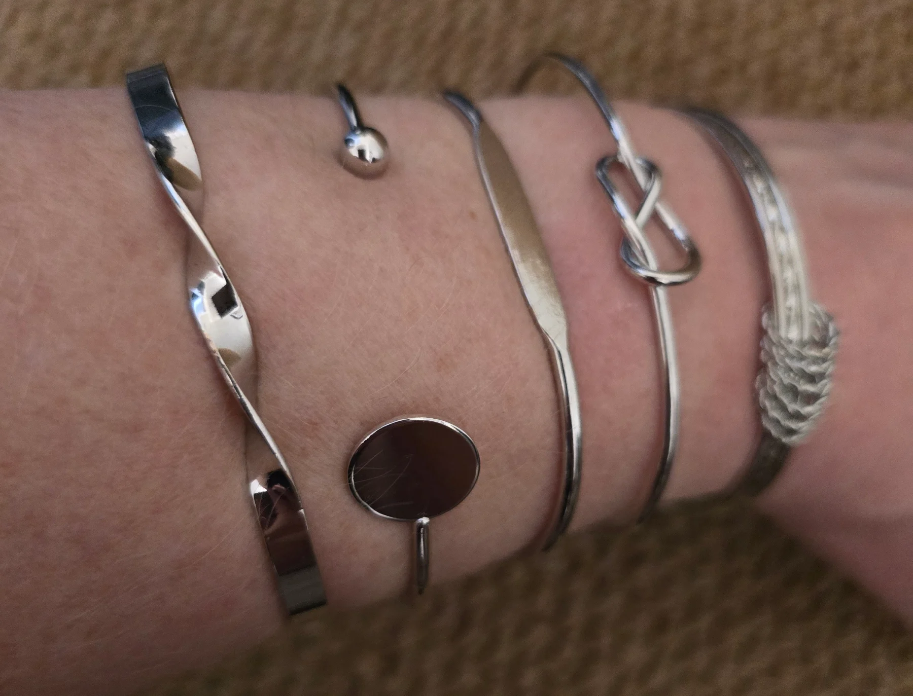 Set of Assorted Silver Tone Bangles.