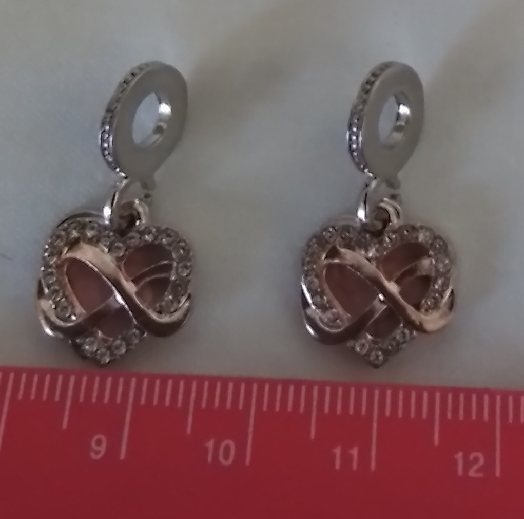 2 heart shaped bracelet charms