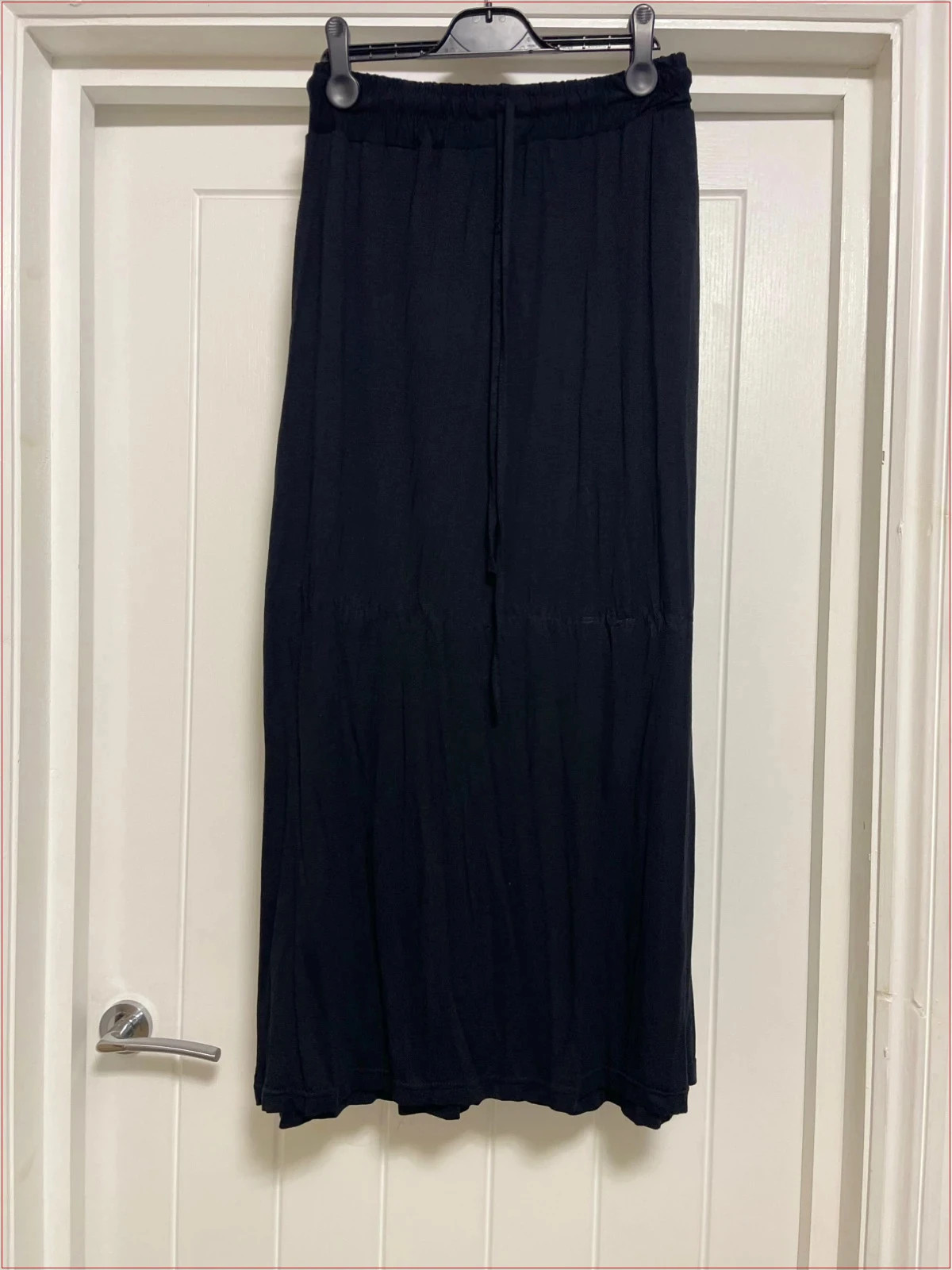 Black jersey maxi skirt with pockets and wide waistband