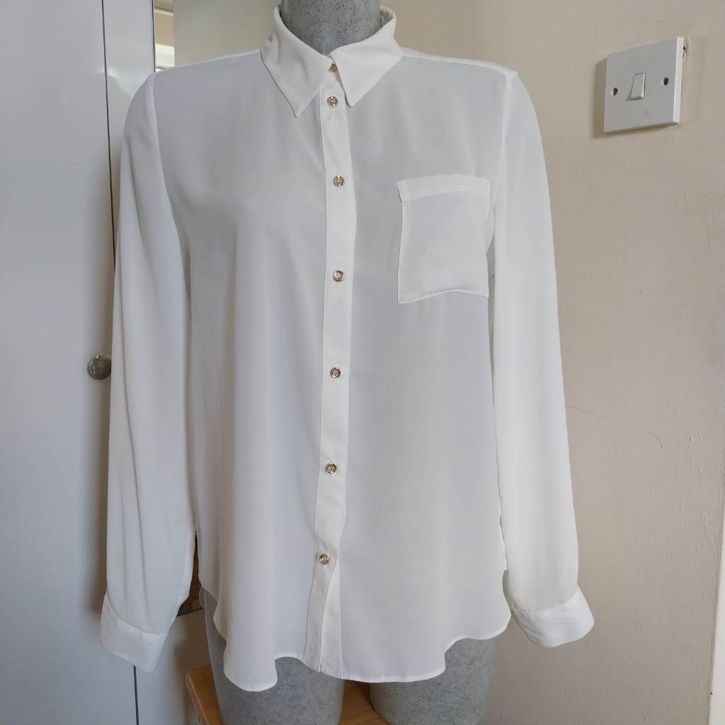 Cream blouse long sleeved and collar button through