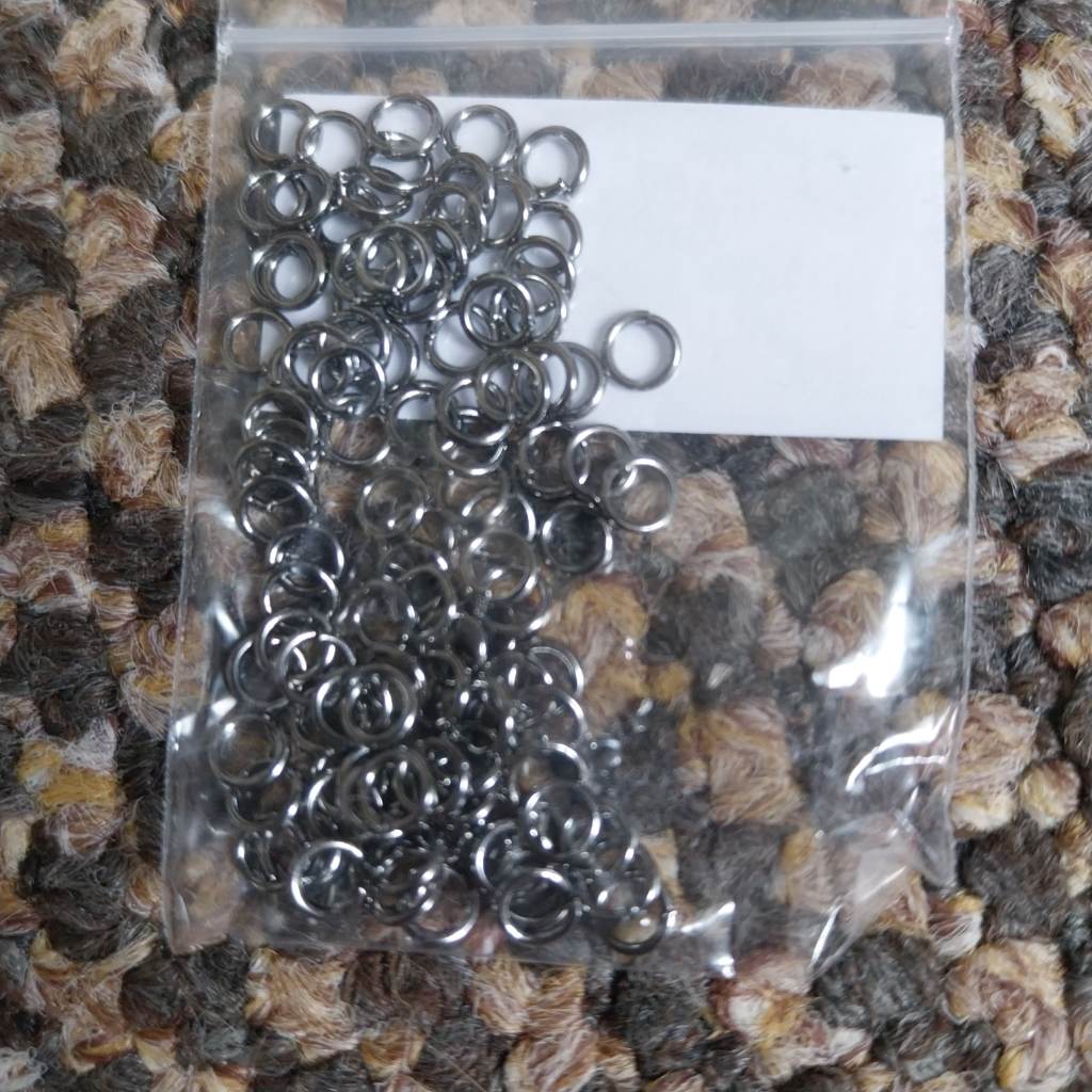 Approx 100 x 4mm jump rings Black coloured