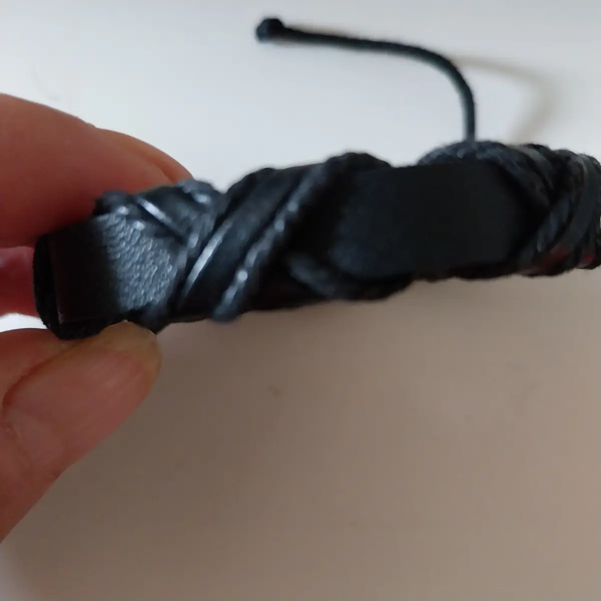 Black leather friendship bracelet with criss cross design