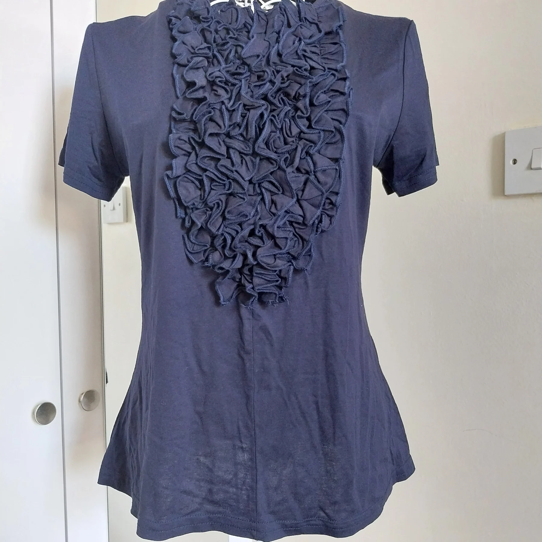 Navy top with front ruffle