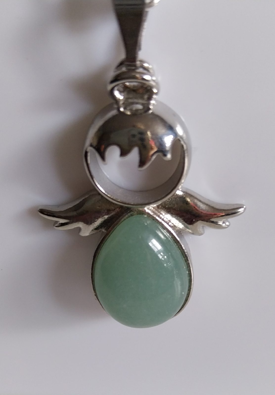 Angel shaped pendant with green stone