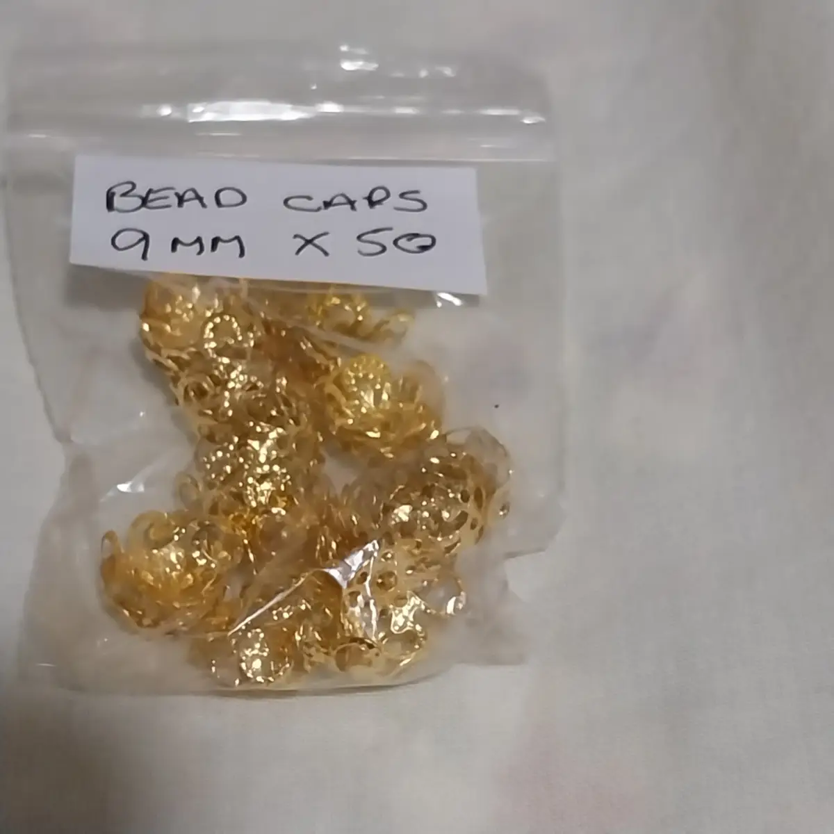 50  x gold coloured Bead caps 9mm