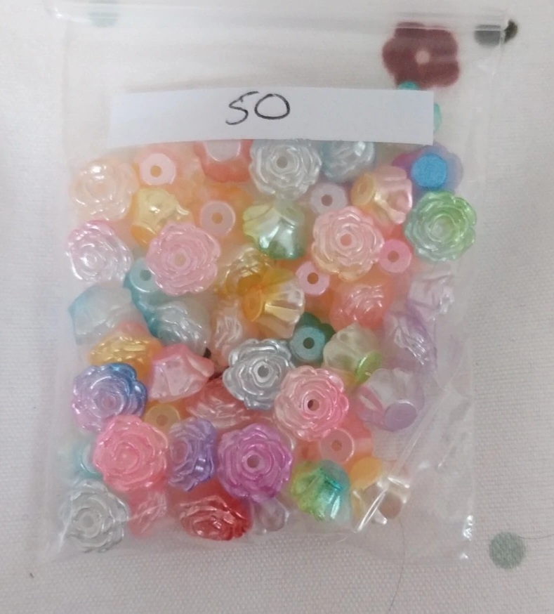 Approx 50 flower shaped multi colour beads
