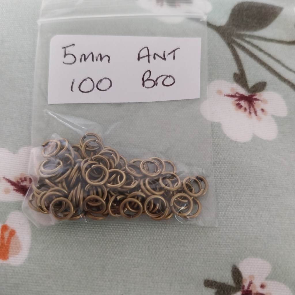 Approx 100 5mm Antique bronze coloured jump rings findings