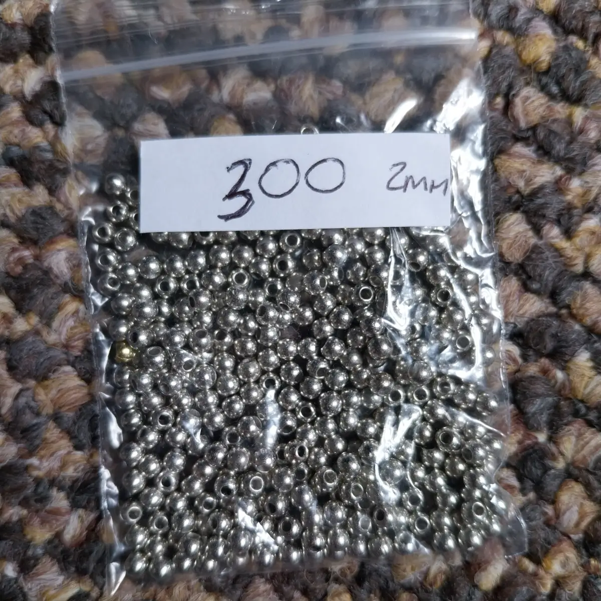 Approx 300 x 2mm silver coloured beads