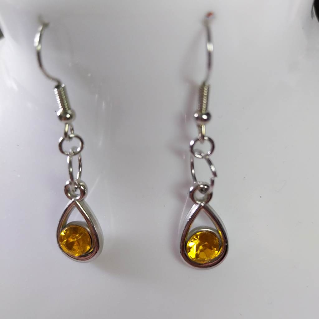 Silver coloured earrings with yellow stone