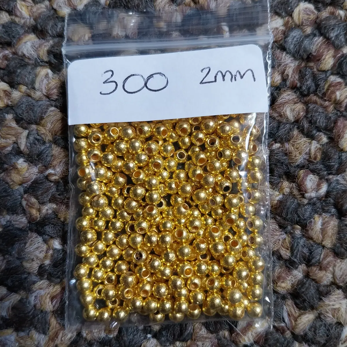 Approx 300 x 2mm gold coloured beads