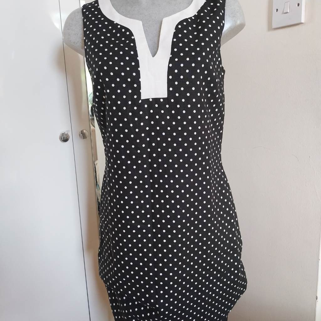 Navy polka Dot dress with white trim zip up back closure