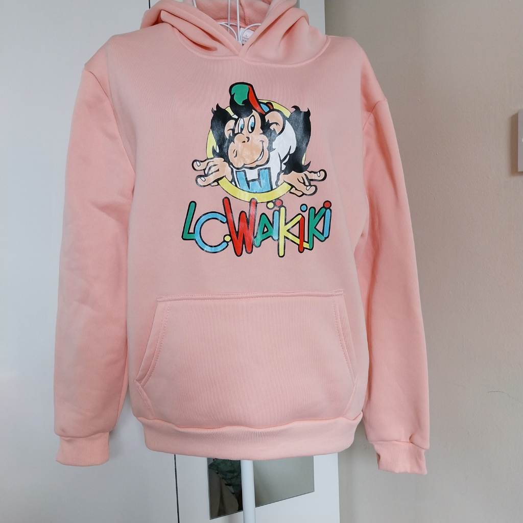 Peach coloured sweatshirt with Lcwaikiki logo